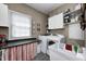 Functional laundry room equipped with modern appliances and natural light at 10846 Hamilton Pass, Fishers, IN 46037