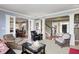 Open living room leading to dining area, featuring elegant columns and hardwood floors at 10846 Hamilton Pass, Fishers, IN 46037