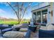 Large backyard patio with outdoor seating, grill and pond view at 10846 Hamilton Pass, Fishers, IN 46037