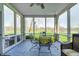 Enclosed porch with dining set, grill and great outdoor view at 10846 Hamilton Pass, Fishers, IN 46037