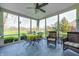 Enclosed porch with dining set, comfortable chairs and panoramic views at 10846 Hamilton Pass, Fishers, IN 46037