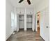 Bedroom showcasing modern closet space with shelving and hardwood flooring at 10880 N 23Rd St, Elwood, IN 46036