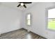 Well-lit bedroom featuring a ceiling fan and sunlit window with a pleasant view at 10880 N 23Rd St, Elwood, IN 46036