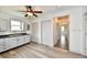 Bright kitchen features modern appliances, gray cabinets, black counters, and a stylish ceiling fan at 10880 N 23Rd St, Elwood, IN 46036