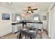 Eat-in kitchen features modern appliances, lots of gray cabinets, and a glass dining table at 10880 N 23Rd St, Elwood, IN 46036