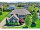 Gorgeous home with fenced yard, basketball court, mature trees, and meticulous landscaping at 11509 Wildlife Ct, Zionsville, IN 46077