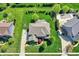 Aerial view showing the backyard of home with patio, outdoor furniture, fire pit, and mature landscaping at 11509 Wildlife Ct, Zionsville, IN 46077