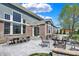 Large patio with dining and lounge areas, ideal for outdoor gatherings at 11509 Wildlife Ct, Zionsville, IN 46077
