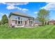 Beautifully landscaped backyard with a large patio and well-maintained lawn at 11509 Wildlife Ct, Zionsville, IN 46077