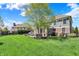Lush backyard with mature trees and a charming patio area at 11509 Wildlife Ct, Zionsville, IN 46077