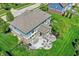Aerial view of backyard with patio, fire pit, dining area, and seating for outdoor relaxation at 11509 Wildlife Ct, Zionsville, IN 46077