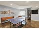 Finished basement with ping pong table, bench seating, decor and space for entertainment and recreation at 11509 Wildlife Ct, Zionsville, IN 46077