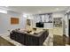 Finished basement with a large sectional sofa, entertainment center, and recessed lighting at 11509 Wildlife Ct, Zionsville, IN 46077