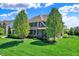 Charming two-story home with manicured lawn and mature trees at 11509 Wildlife Ct, Zionsville, IN 46077