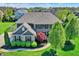 Charming home featuring a well-kept lawn, mature landscaping, and classic architectural details at 11509 Wildlife Ct, Zionsville, IN 46077