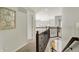 Upstairs hallway with wood railing overlooking foyer at 11509 Wildlife Ct, Zionsville, IN 46077