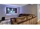 Finished basement home theater room with large screen projector and comfortable seating for entertainment at 11509 Wildlife Ct, Zionsville, IN 46077