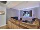 Finished basement home theater room with large screen projector, comfortable seating and stylish decor at 11509 Wildlife Ct, Zionsville, IN 46077