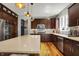 Gourmet kitchen with stainless steel appliances and wooden cabinets at 11509 Wildlife Ct, Zionsville, IN 46077