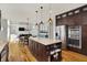 Well-appointed kitchen with a large center island, stainless steel appliances, and wood cabinetry at 11509 Wildlife Ct, Zionsville, IN 46077