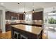 Stylish kitchen featuring a center island, stainless appliances, and wooden cabinetry at 11509 Wildlife Ct, Zionsville, IN 46077