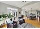 Inviting living room with hardwood floors, French doors, and comfortable seating at 11509 Wildlife Ct, Zionsville, IN 46077