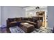 Finished basement living area with comfortable seating, projector, view into wet bar, and stylish decor at 11509 Wildlife Ct, Zionsville, IN 46077