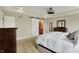 A spacious main bedroom features a sliding barn door and a view into the ensuite bathroom at 11509 Wildlife Ct, Zionsville, IN 46077