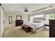 Spacious main bedroom suite with tray ceiling and natural light at 11509 Wildlife Ct, Zionsville, IN 46077