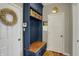 Charming mudroom features built-in storage, bench seating, and stylish decor at 11509 Wildlife Ct, Zionsville, IN 46077