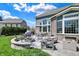 Inviting stone patio with a fire pit and outdoor seating, perfect for entertaining at 11509 Wildlife Ct, Zionsville, IN 46077