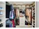 A custom walk-in closet features rods and shelving for optimized clothing and shoe storage at 11509 Wildlife Ct, Zionsville, IN 46077