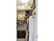 A fully organized walk-in closet with shelving to maximize storage of clothes and luggage at 11509 Wildlife Ct, Zionsville, IN 46077