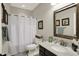Bathroom featuring a large mirror, single sink, vanity, and shower with white curtain at 11685 Platt St, Noblesville, IN 46060