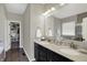 Bathroom featuring dual sinks, a walk-in closet, and a glass-enclosed shower at 11685 Platt St, Noblesville, IN 46060