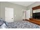 Bright bedroom features white doors, neutral paint, and light-filled adjoining hallway at 11685 Platt St, Noblesville, IN 46060