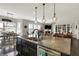 Spacious kitchen with granite island, stainless steel dishwasher, and an open layout at 11685 Platt St, Noblesville, IN 46060