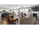 Open-concept living area featuring fireplace, hardwood floors, and an eat-in kitchen at 11685 Platt St, Noblesville, IN 46060