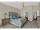 Bright main bedroom features a tufted headboard, patterned bedding, and a decorative light fixture at 11685 Platt St, Noblesville, IN 46060