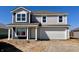 New two-story home with a two-car garage and a combination of gray siding and dark blue siding accents at 1268 Fleming Dr, Greenfield, IN 46140