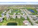 Expansive aerial view of a residential area featuring ponds, green spaces and attractive homes at 12894 Corydon Dr, Fishers, IN 46037