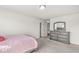 Bedroom featuring gray walls, neutral carpet, and a gray dresser with a mirror at 12894 Corydon Dr, Fishers, IN 46037