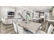 Dining area featuring a large table with seating for six with a view into the living room and kitchen at 12894 Corydon Dr, Fishers, IN 46037