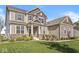 Charming two-story home featuring a covered porch and well-maintained landscaping, perfect for curb appeal at 12894 Corydon Dr, Fishers, IN 46037