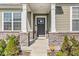 Inviting front entrance featuring brick accents and well-maintained landscaping for added curb appeal at 12894 Corydon Dr, Fishers, IN 46037