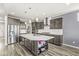 Spacious kitchen with a large center island with storage, stainless steel appliances, and modern finishes at 12894 Corydon Dr, Fishers, IN 46037