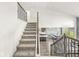 Open-concept living space with staircase and views of dining and kitchen at 12894 Corydon Dr, Fishers, IN 46037