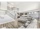 An open-concept living room showcasing the staircase and kitchen, perfect for gatherings at 12894 Corydon Dr, Fishers, IN 46037