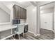 Well-lit office space with modern desk, cabinets, and gray flooring at 12894 Corydon Dr, Fishers, IN 46037