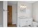 Bright bathroom featuring vanity with granite countertop, modern fixtures, and ample lighting at 13 N Main St, Brooklyn, IN 46111